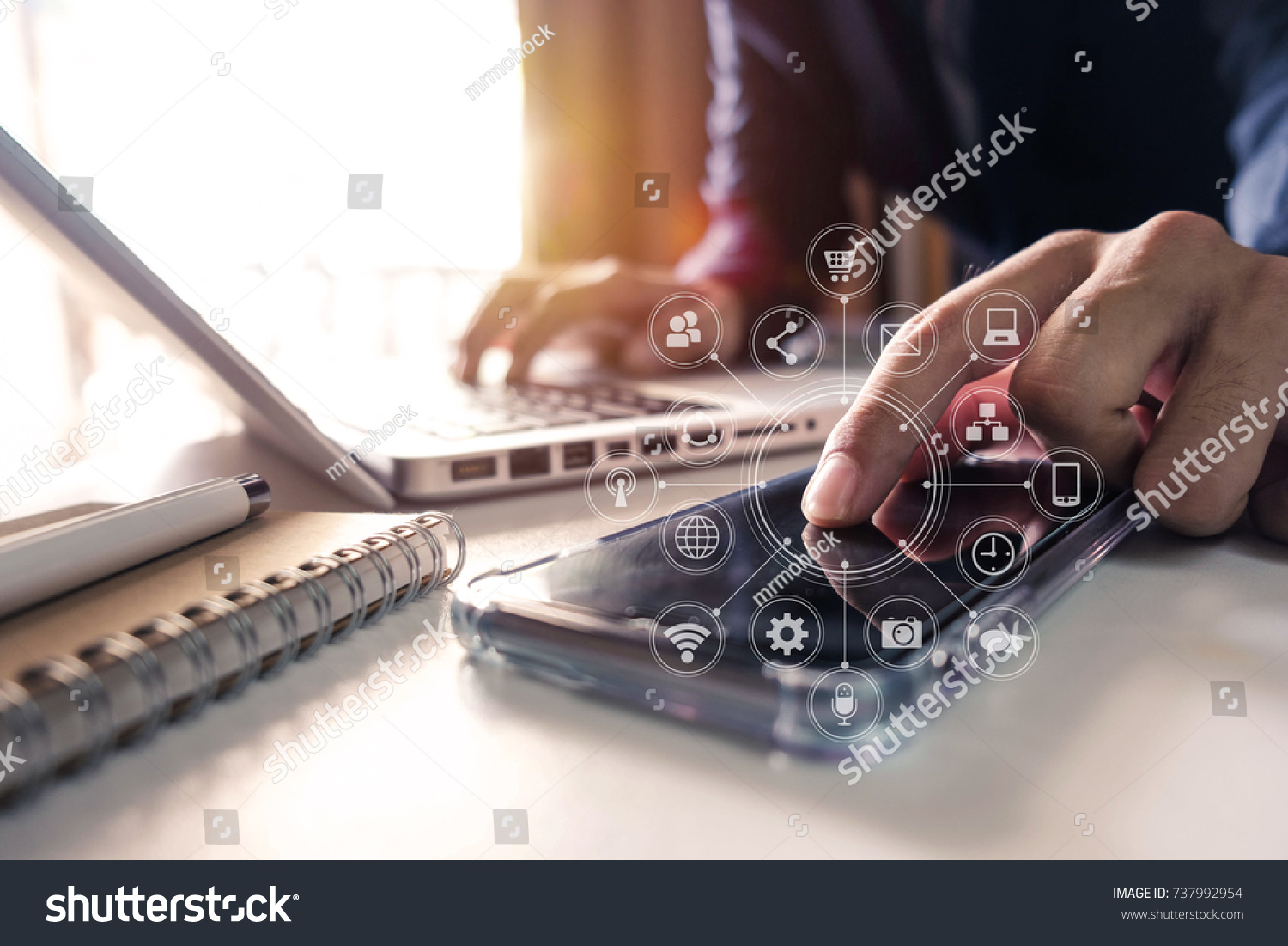 businessman hand working with finances about cost and calculator and laptop with tablet and smartphone on with desk in modern office in morning light.
 #737992954