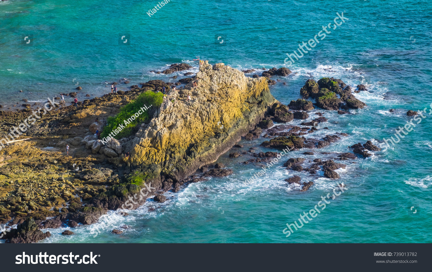 Huge Stone and Turquoise Color of Sea with waves from wind, Phuket, Thaialnd.  #739013782