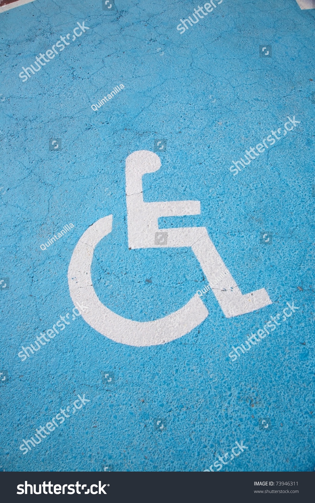 only handicapped parking sign on the asphalt ground #73946311