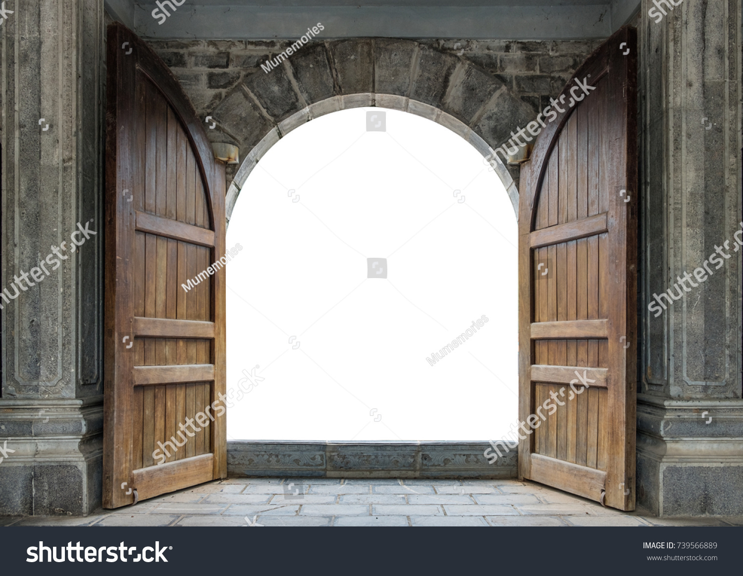 Large wooden door open in rock castle wall #739566889