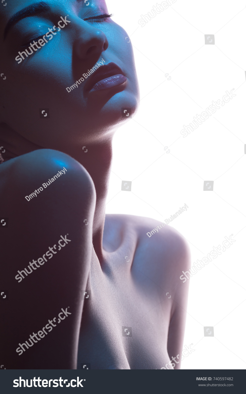 Close-up art fashion studio portrait of nude sensual woman with closed eyes on white background. Profile of attractive mixed race Asian Caucasian female model. Perfect slim body. Beauty and health #740597482