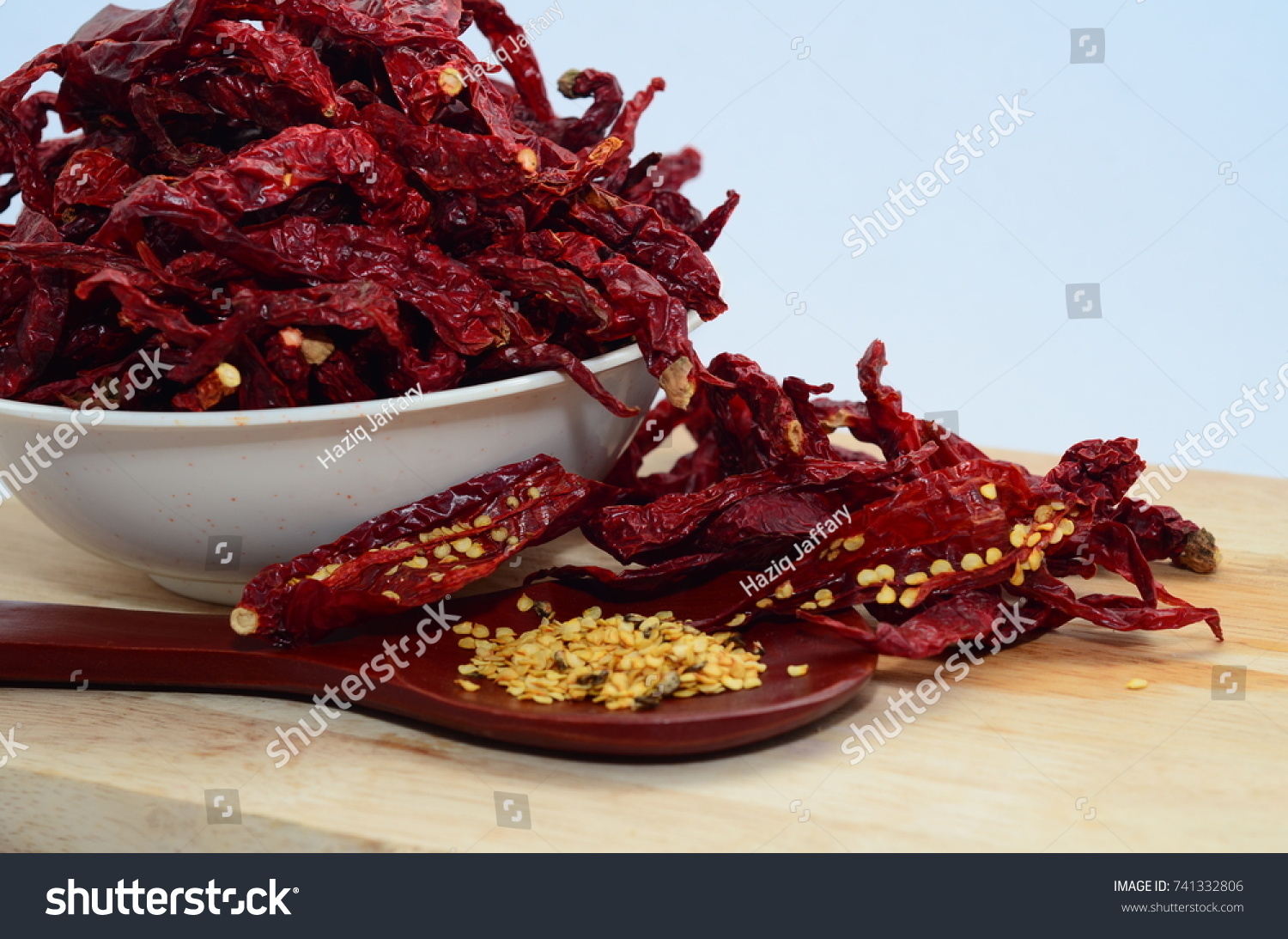 Dried Chili with chili seed on Cutting board inside the bowl #741332806