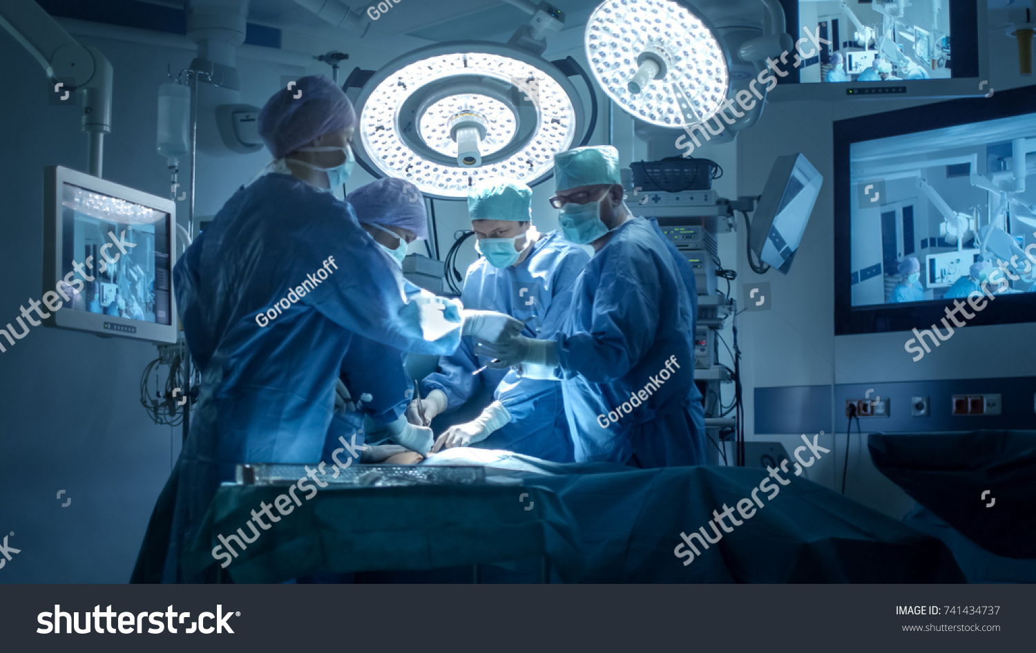 Medical Team Performing Surgical Operation in Modern Operating Room #741434737