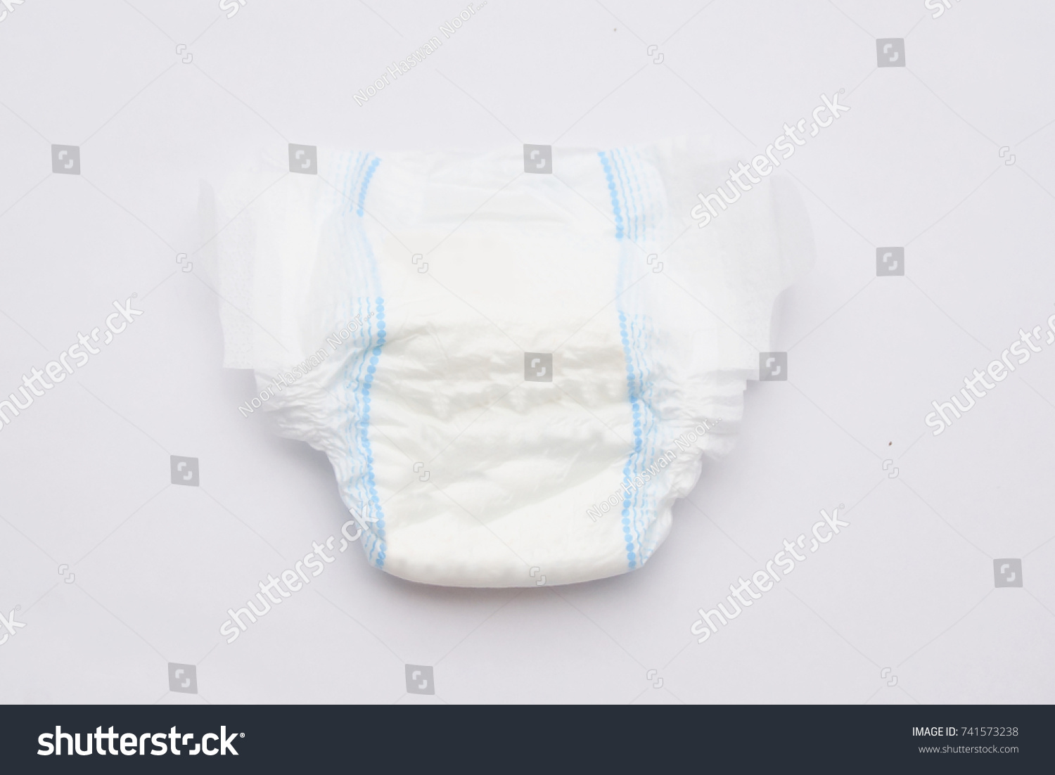 Disposable Baby Diapers Over White Background #741573238