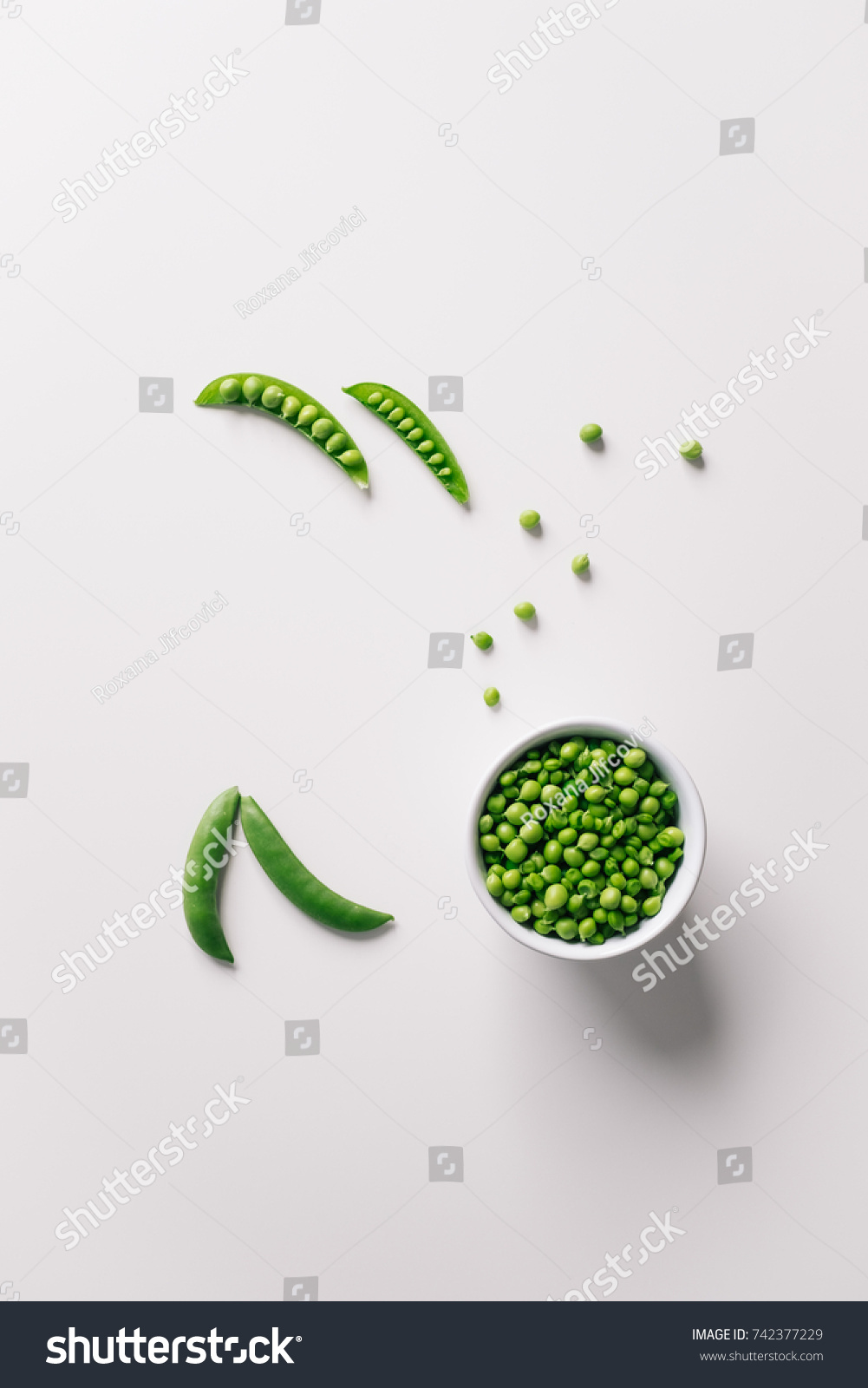 Healthy bowl of green pea on white background. Top view with copy space. #742377229