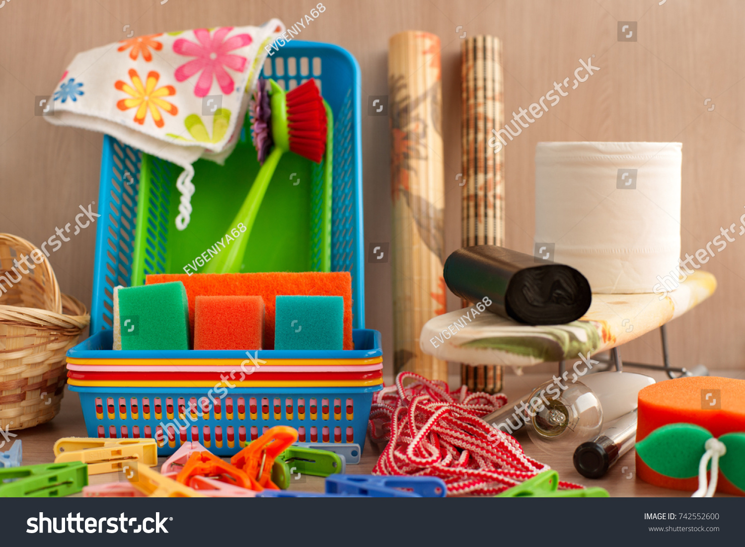 Many household goods. Ironing board, plastic boxes, toilet paper, garbage bags, parallon sponges, clothespins are household utensils. Household items for everyday life. #742552600