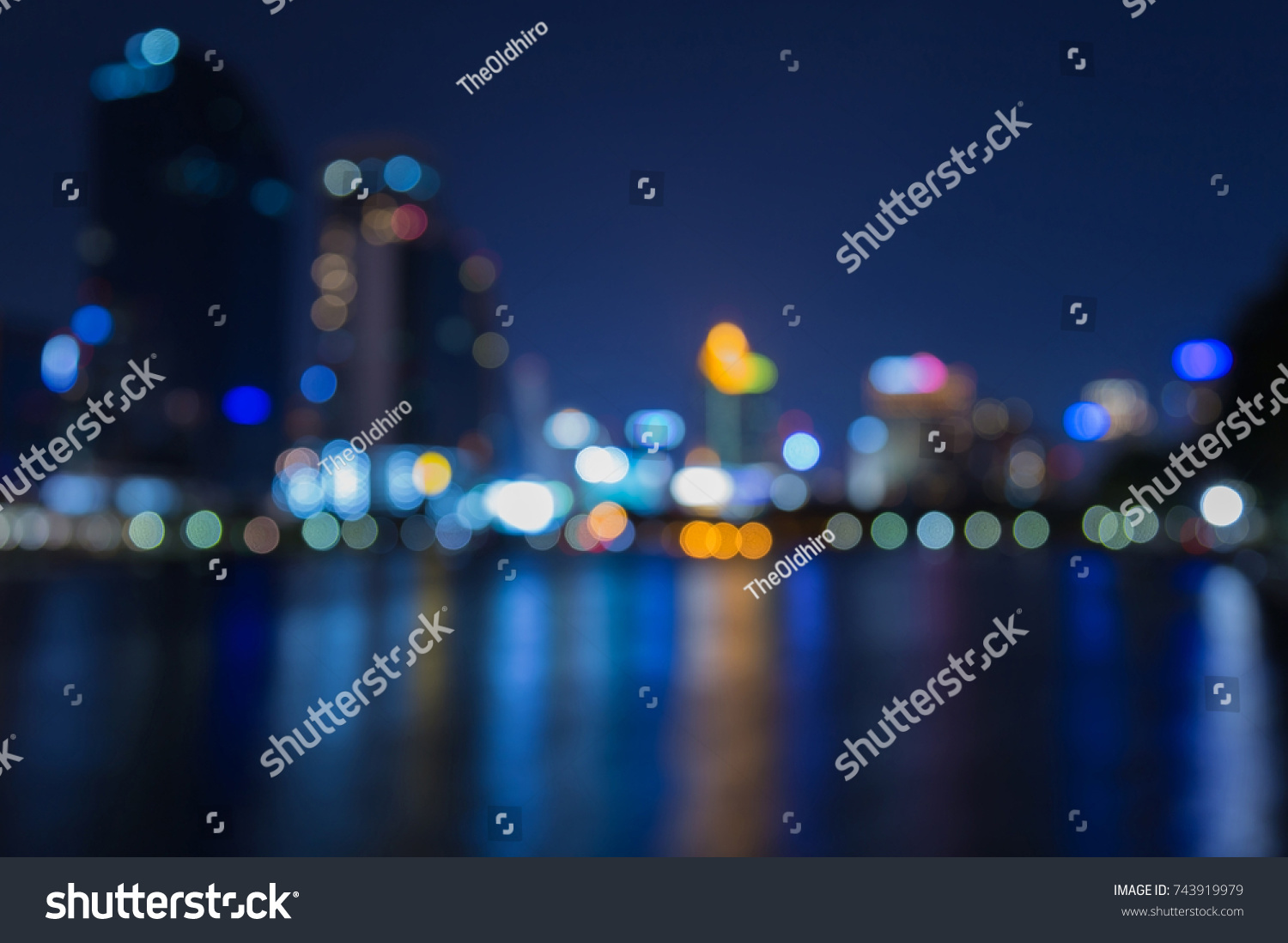 Night twilight blurred bokeh city downtown water front, abstract background #743919979