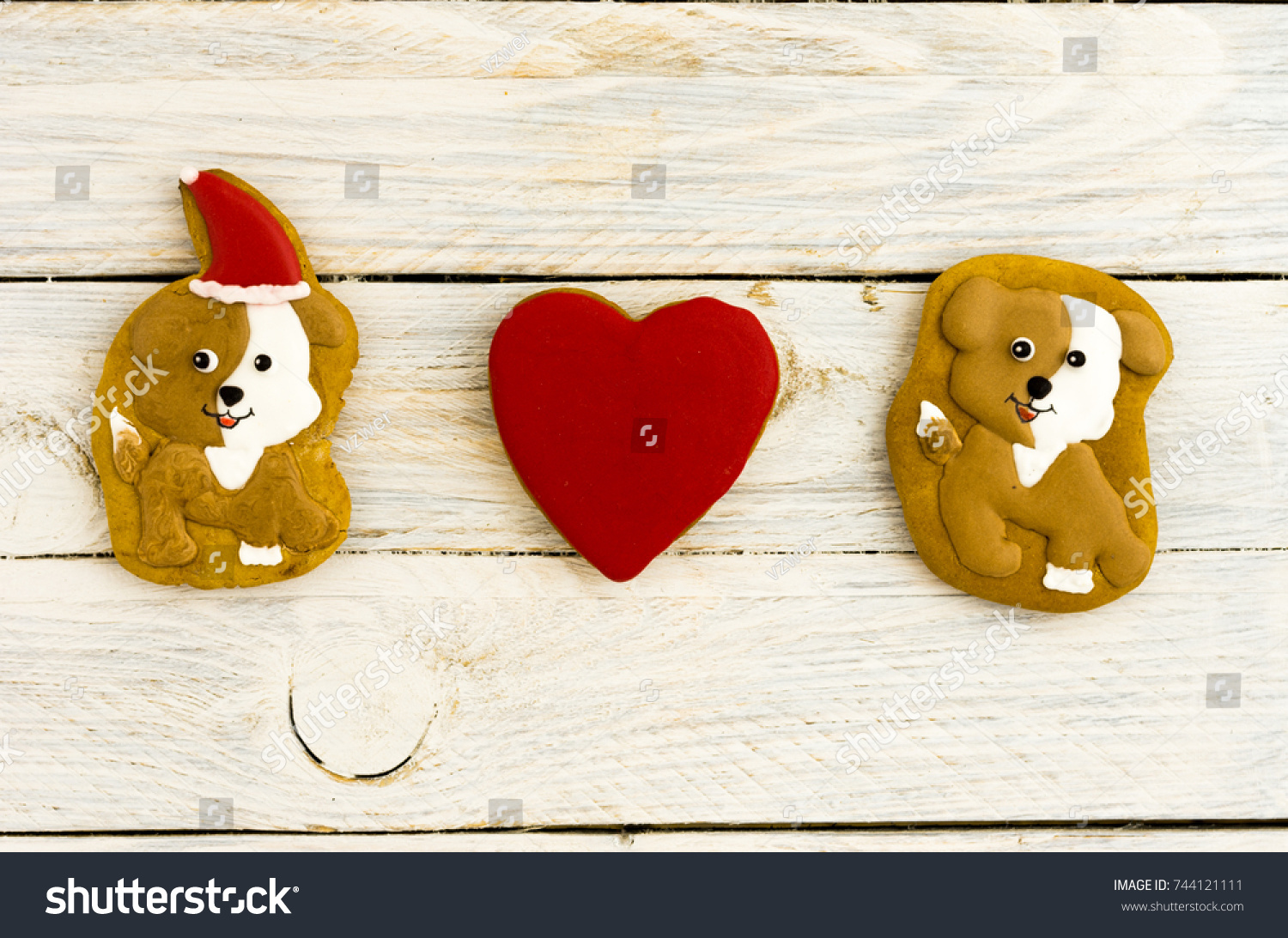 Dogs and heart. Love of dogs. Composition of gingerbread. White background. #744121111