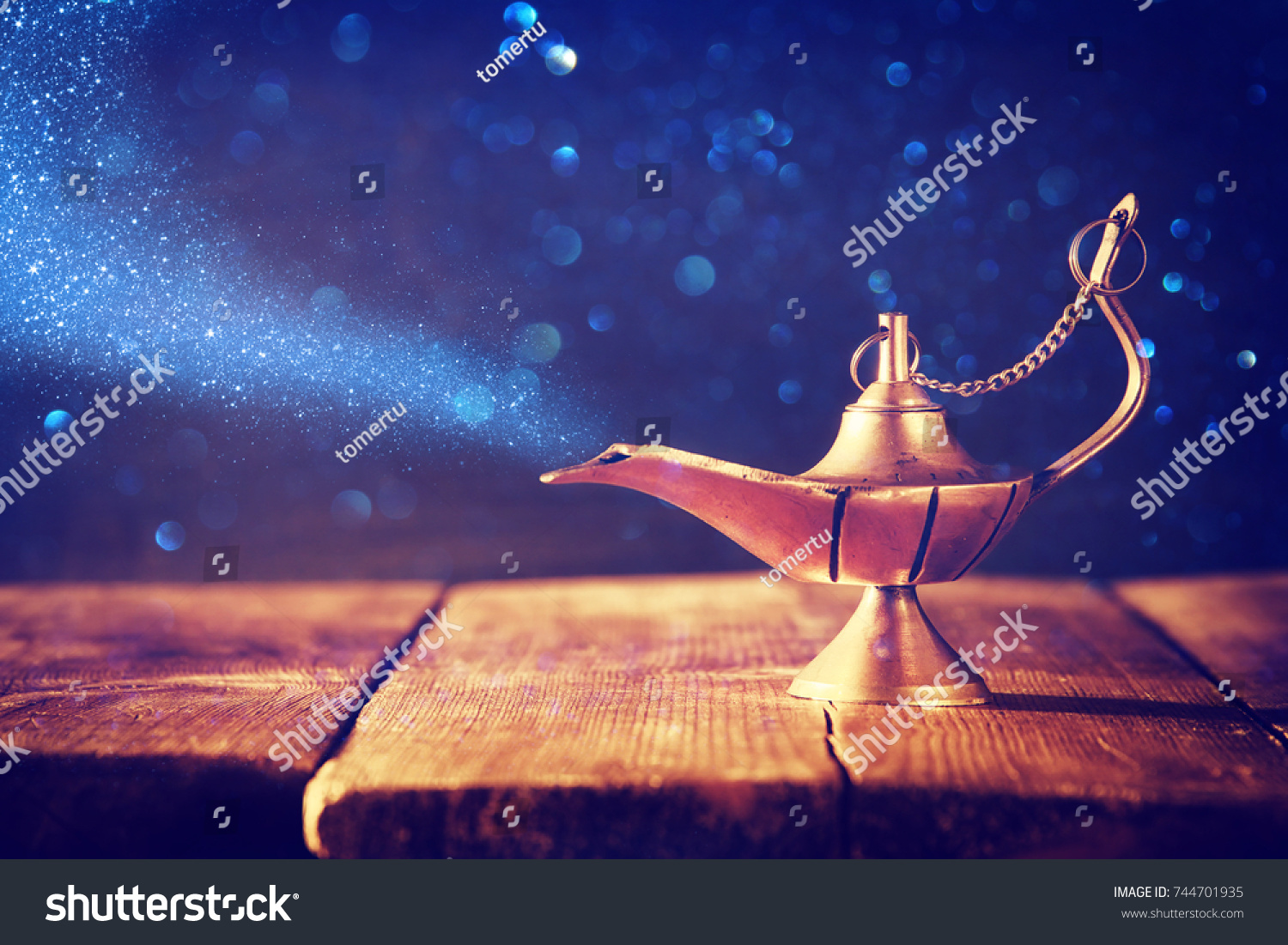 Image of magical aladdin lamp with glitter smoke. Lamp of wishes #744701935