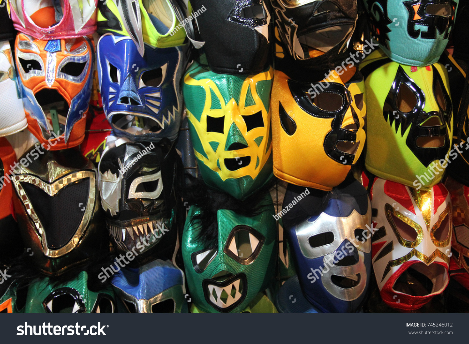 A selection of colorful "Lucha Libre" Mexican professional wrestling masks, for sale outside of Arena Mexico, Mexico City #745246012