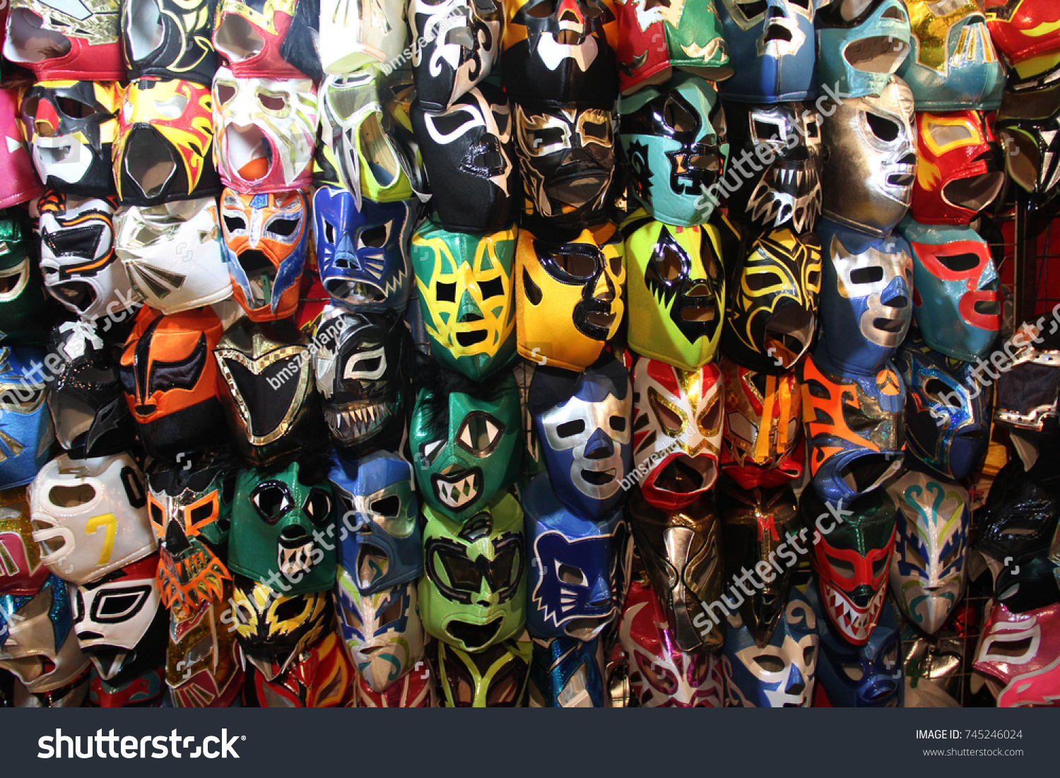 A selection of colorful "Lucha Libre" Mexican professional wrestling masks, for sale outside of Arena Mexico, Mexico City #745246024