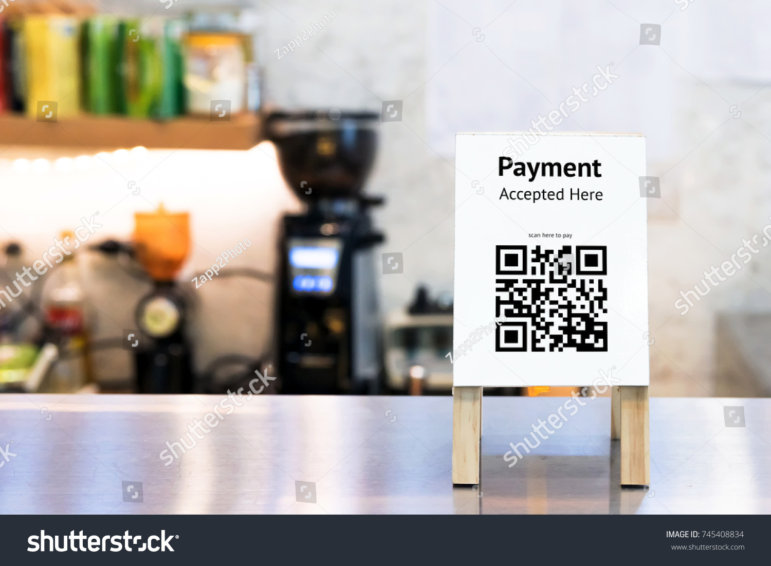 Qr code payment , online shopping , cashless society technology concept. Coffee shop accepted digital pay without money , wood stand tag on table. #745408834