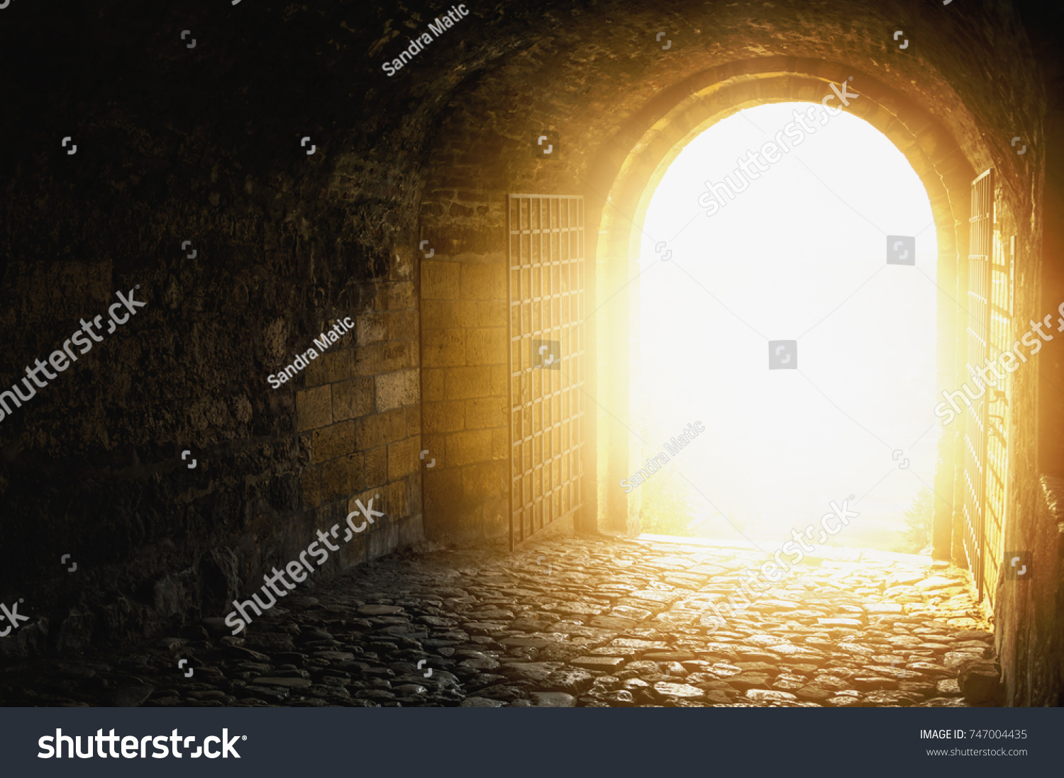 Door to Heaven. Arched passage open to heaven`s sky. Light at end of the tunnel. Hope metaphor. #747004435