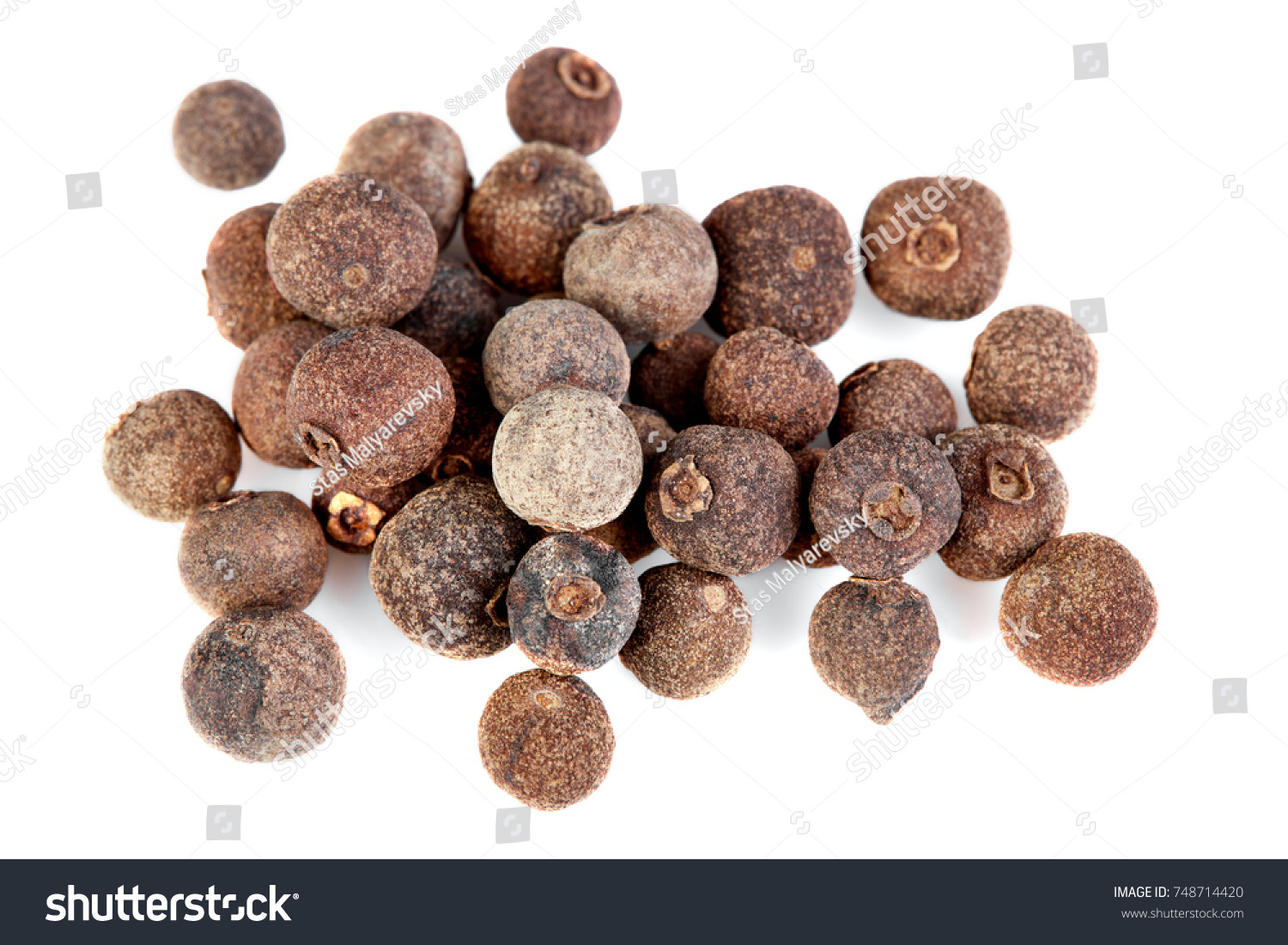 whole allspice isolated on white background. Aromatic allspice. #748714420