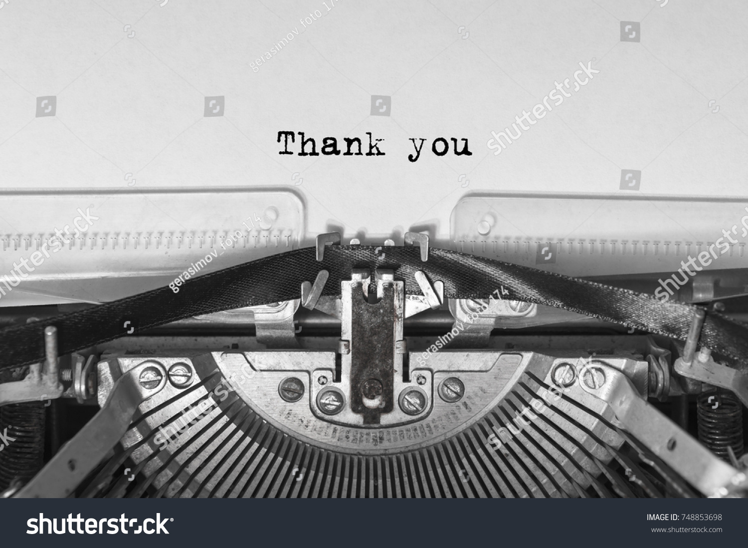 Vintage old typewriter on white background with text thank you. Close up. #748853698