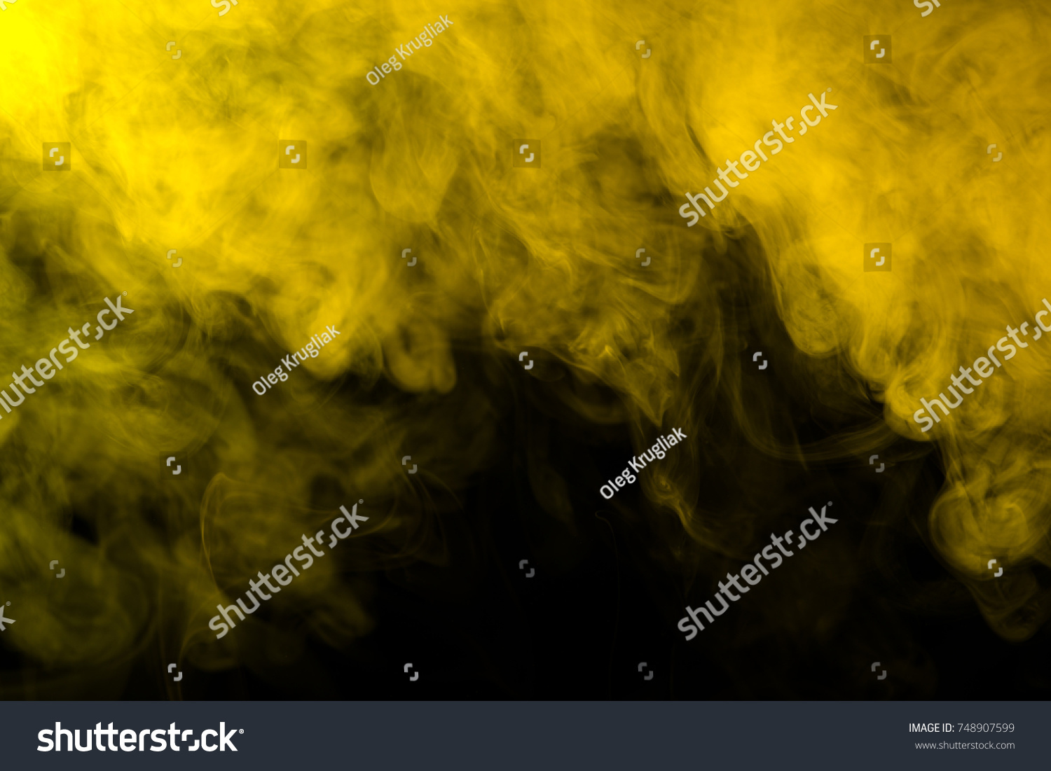 Yellow smoke on a black background #748907599