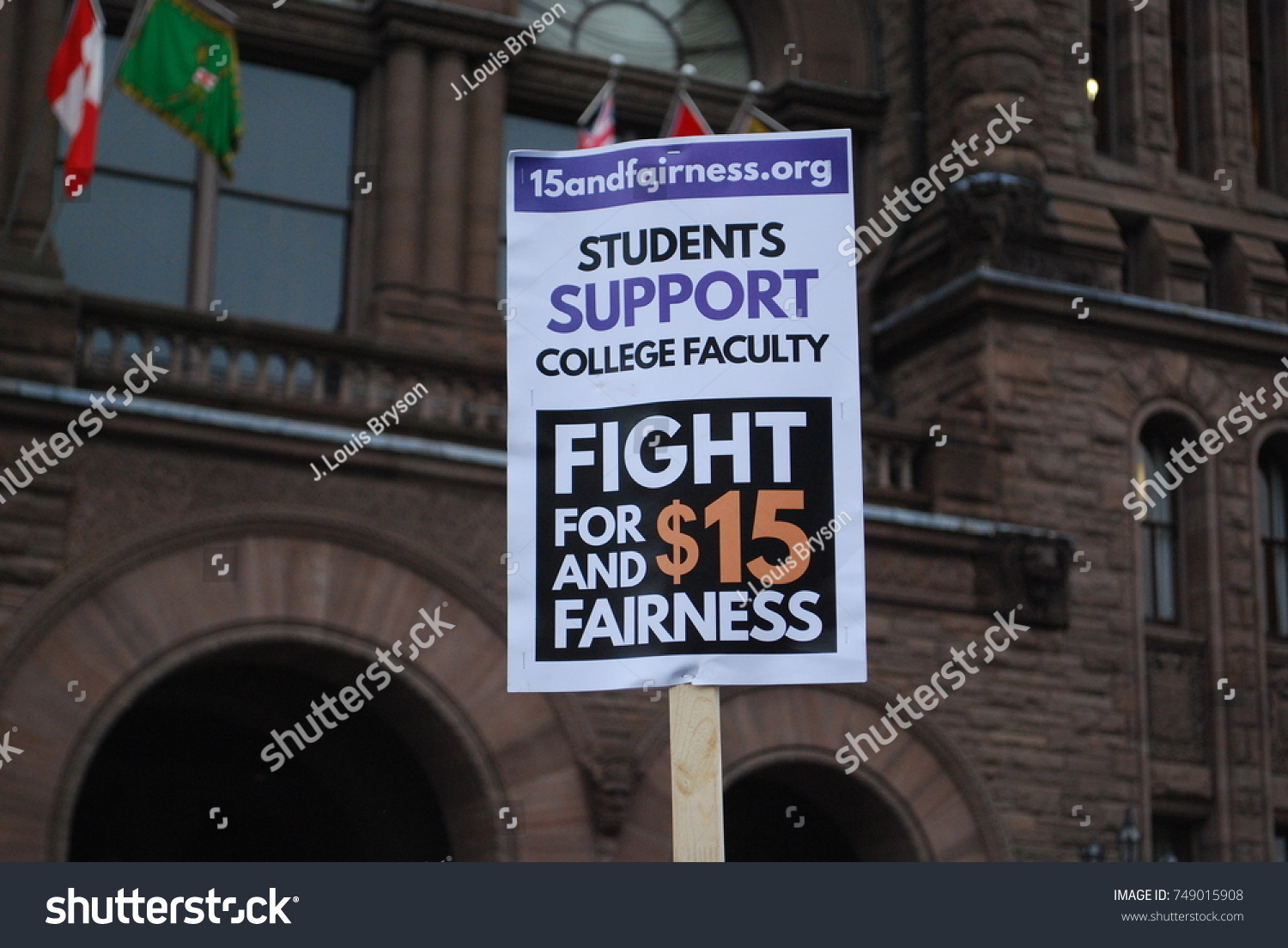 TORONTO, CANADA: November 2 2017 - $15 Minimum Wage Protest Sign, Rally At Queens Park, Government Building Protest, Students Who Cannot Afford University And College, Minimum Wage Political Problems #749015908