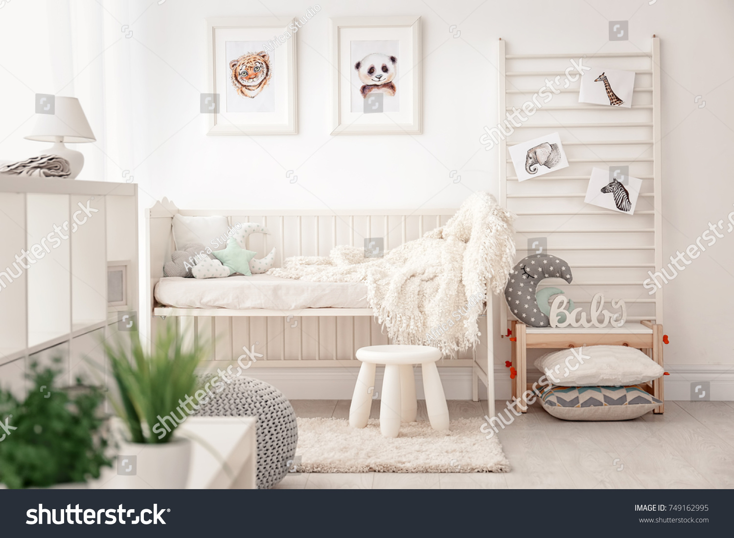 Baby bedroom decorated with pictures of animals #749162995