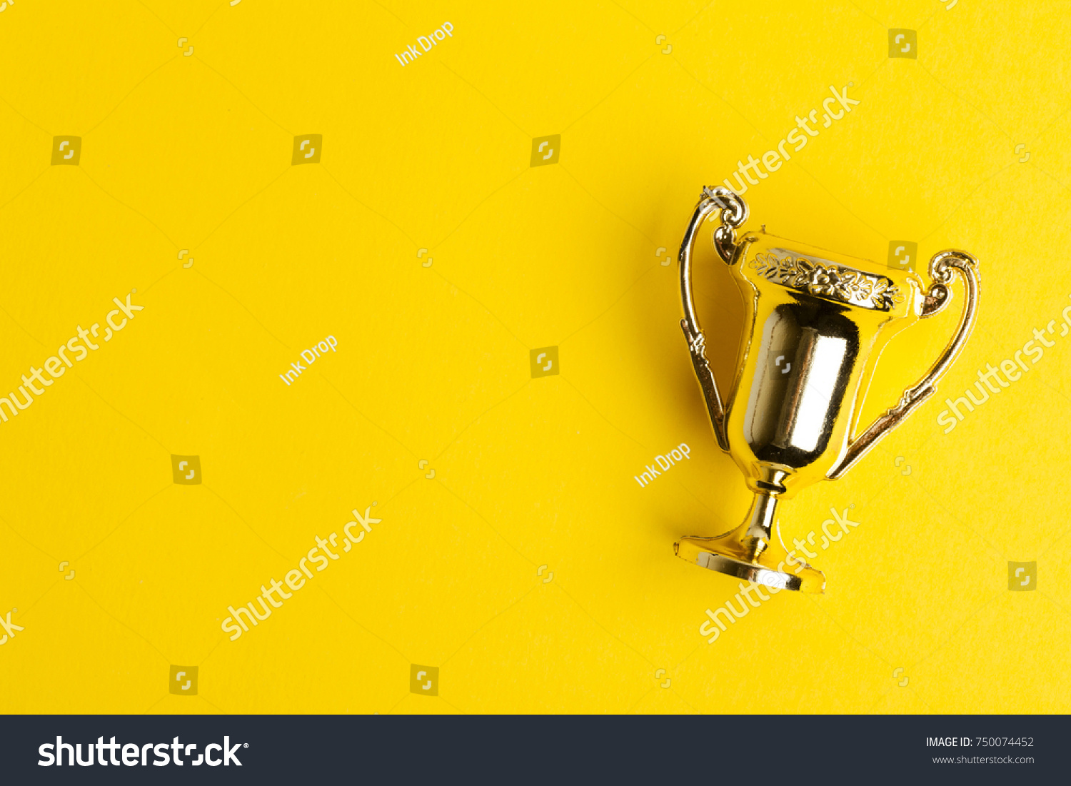 Gold winners achievement trophy on a yellow background #750074452