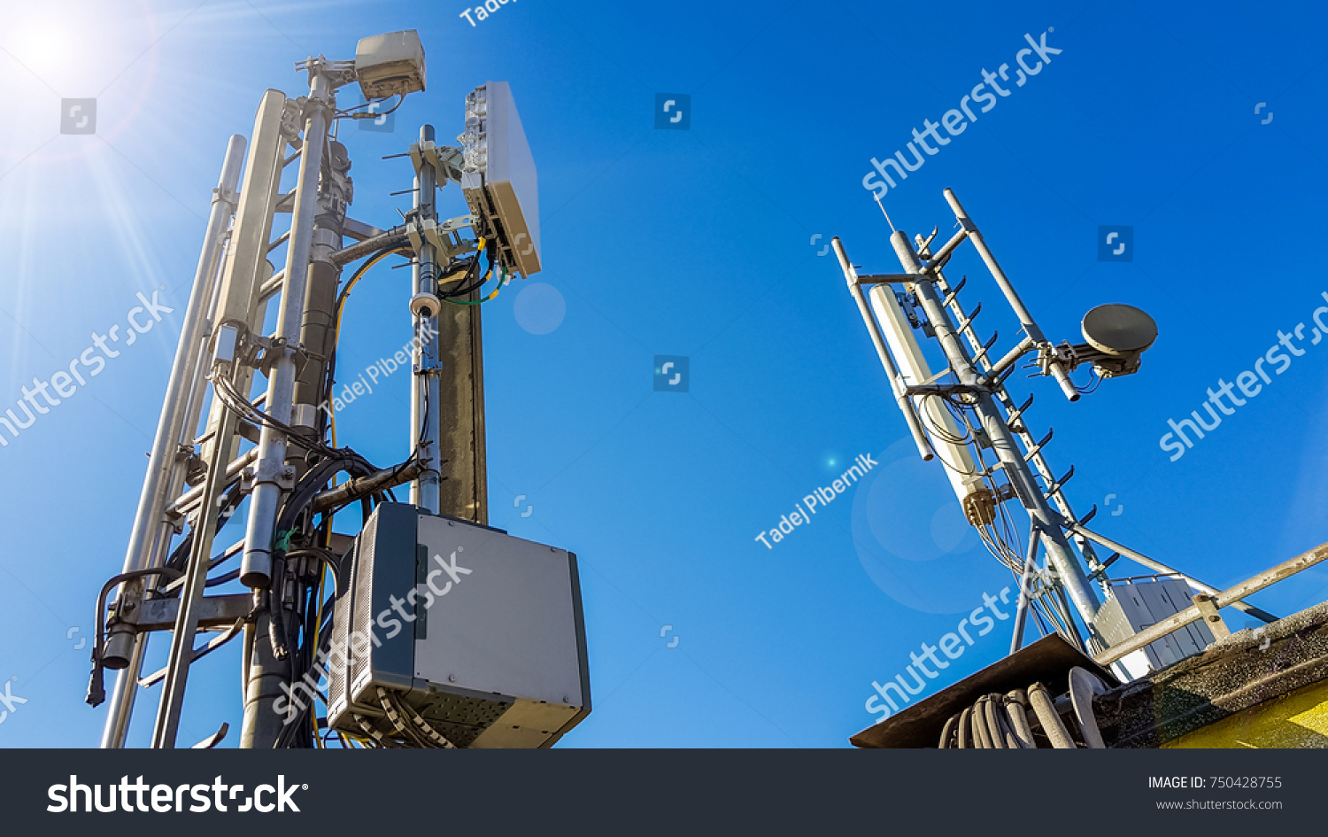 5G smart mobile telephone radio network antenna base station on the telecommunication mast radiating signal #750428755