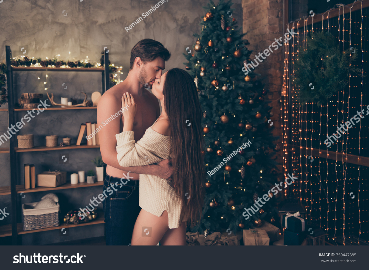 Brunet partner embrace his brunette, hot ass bum butt, sensual night, cute feelings, temptation pleasure, celebrate christmastime, gifts, boxes, presents under firtree, interior #750447385