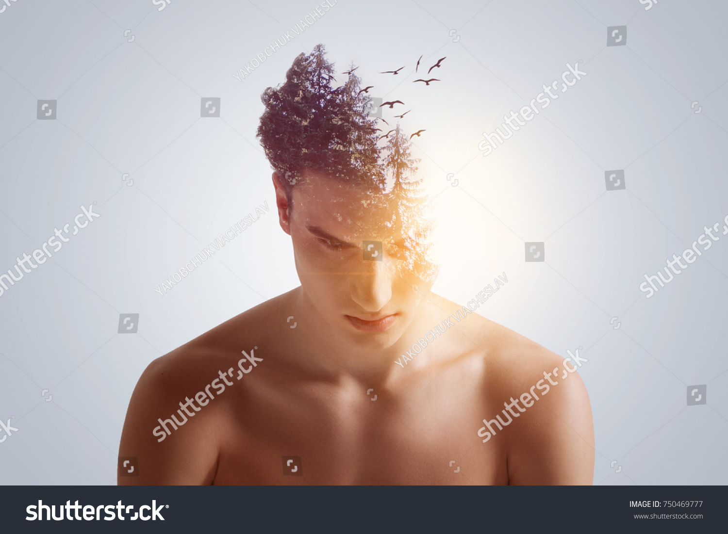 New idea birth. Good-looking open-headed  focused guy looking down with lowering shoulders  on the grey background  #750469777