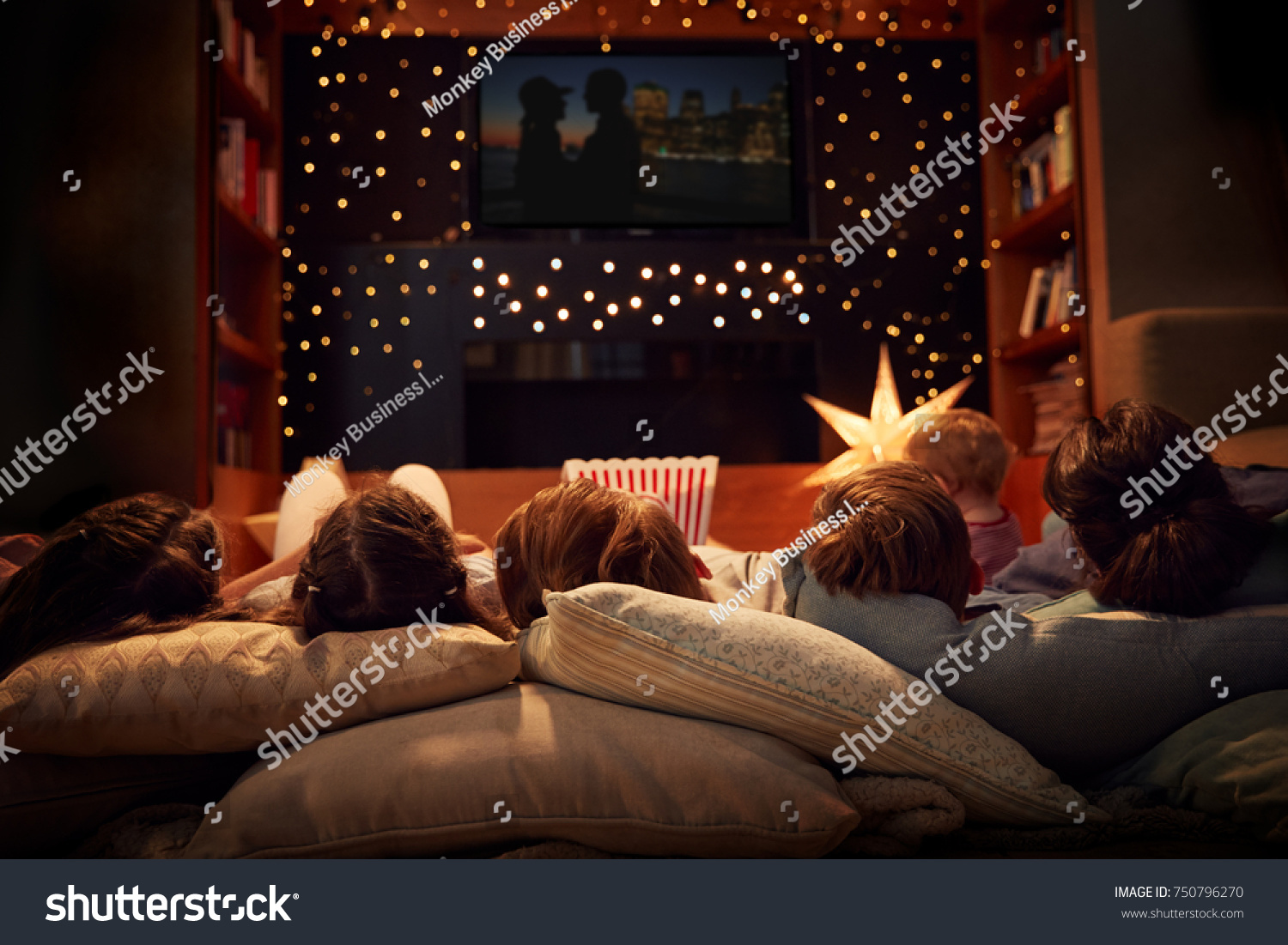 Family Enjoying Movie Night At Home Together #750796270