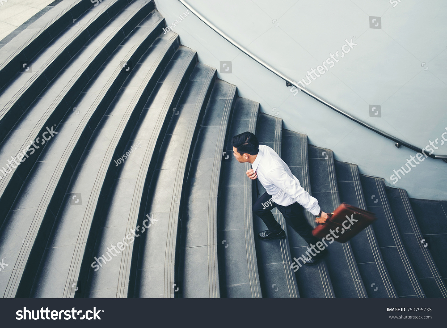 Businessman running fast upstairs Growth up Success concept #750796738