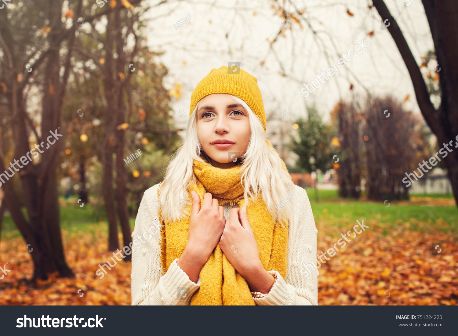 Pretty Autumn Woman with Yellow Cotton Scarf and Hat Outdoors #751224220