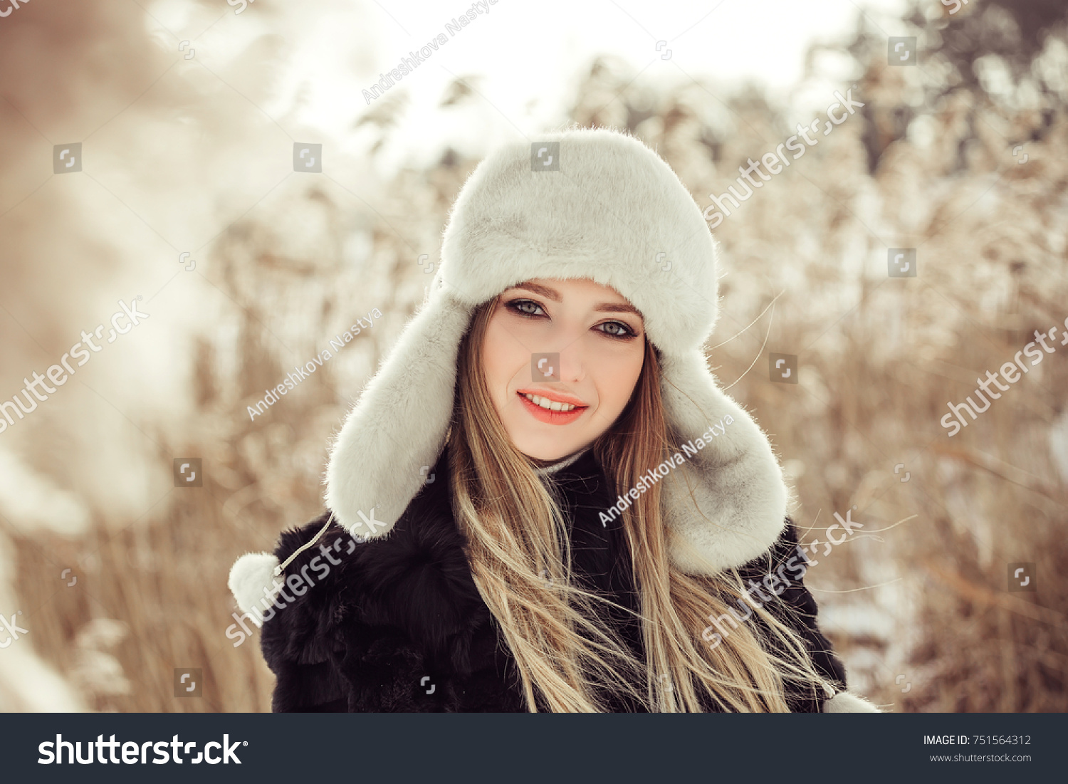 Winter portrait of cheerful young pretty girl. Seasons, outdoor, beauty concept #751564312