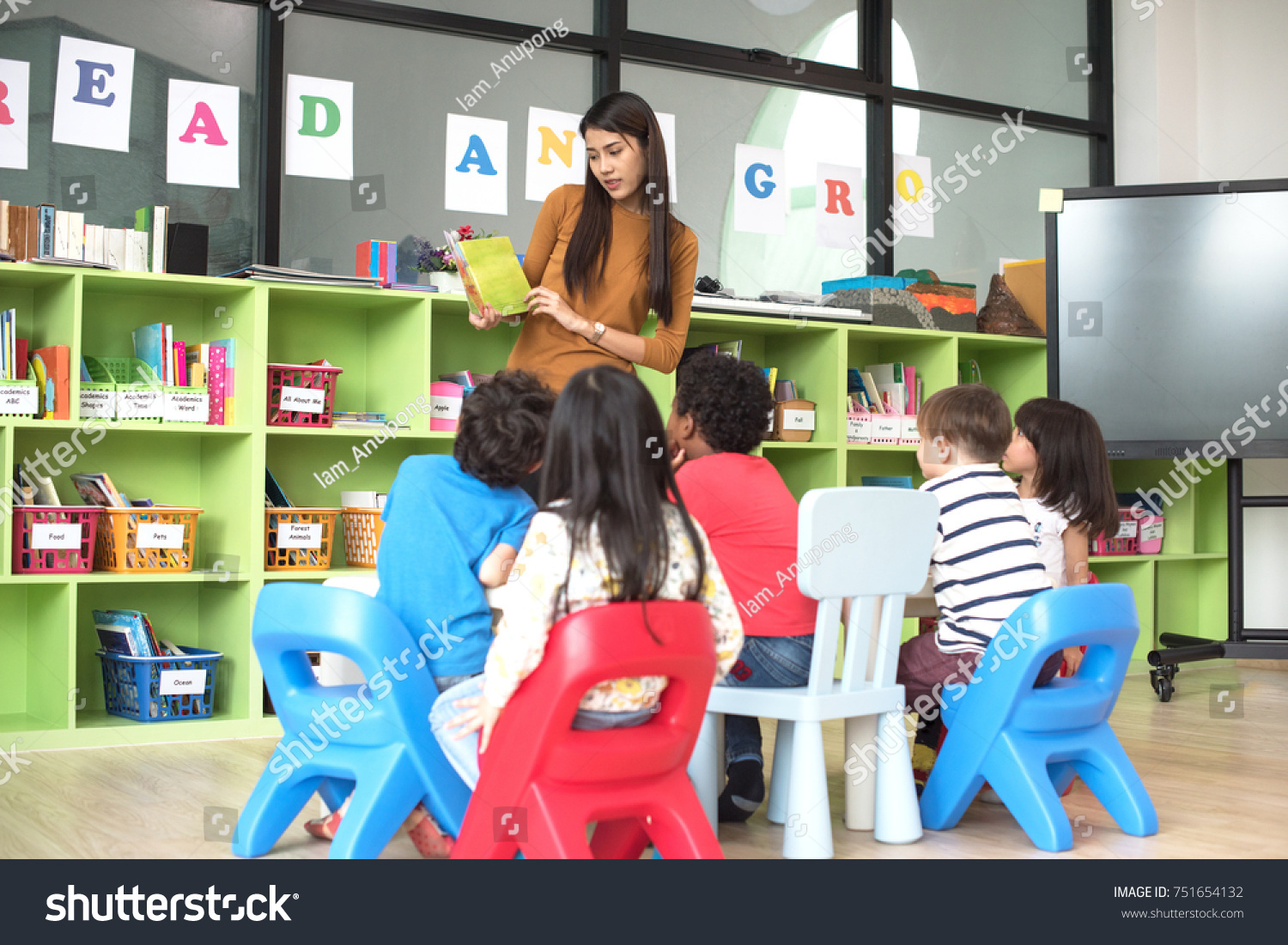 teacher attend in teaching preschool kids kindergarten to learning in the class room together #751654132