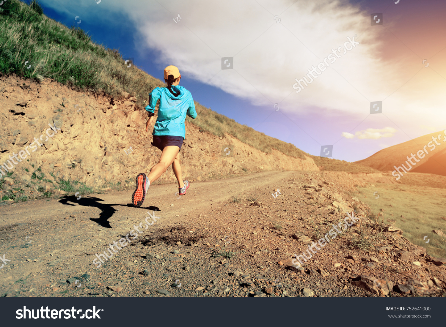young fitness woman runner running on mountain trail #752641000