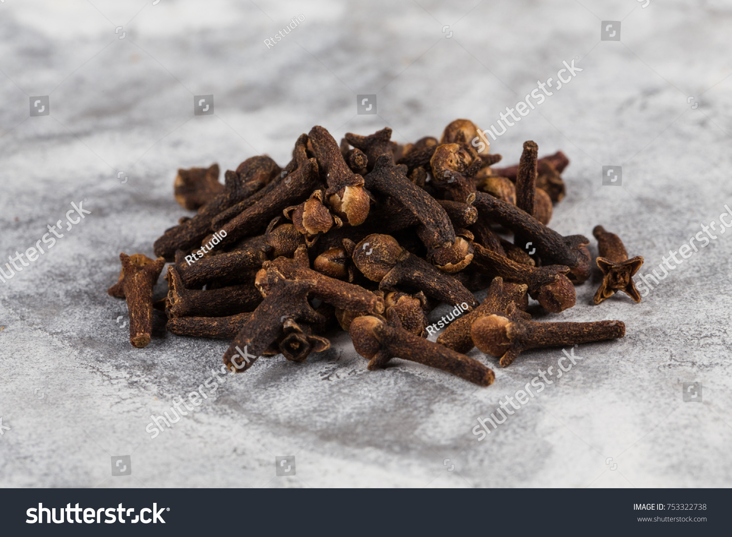 Drying clove spice (Syzygium aromaticum) Cloves are the aromatic flower buds of a tree #753322738
