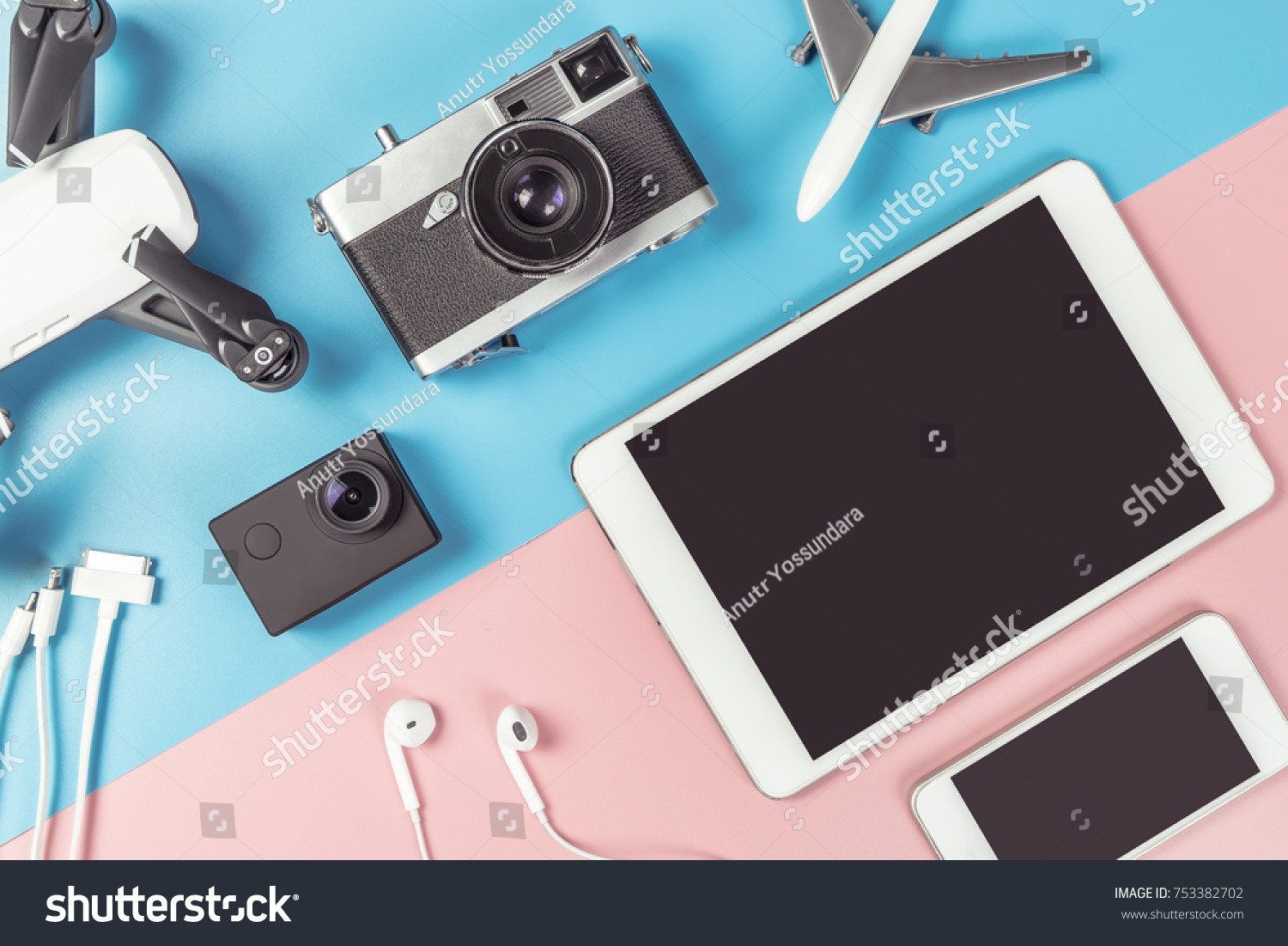 Travel Photographer gadgets and accessories object flat lay Top view on blue and pink background for travel concept with Blank Tablet and Mobile phone screen for Application mock up  #753382702