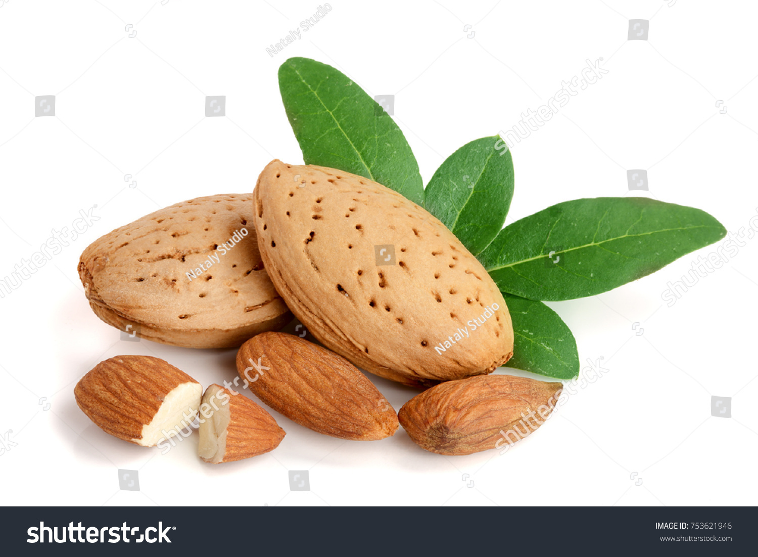 Group of almond nuts with leaves isolated on a white background. #753621946