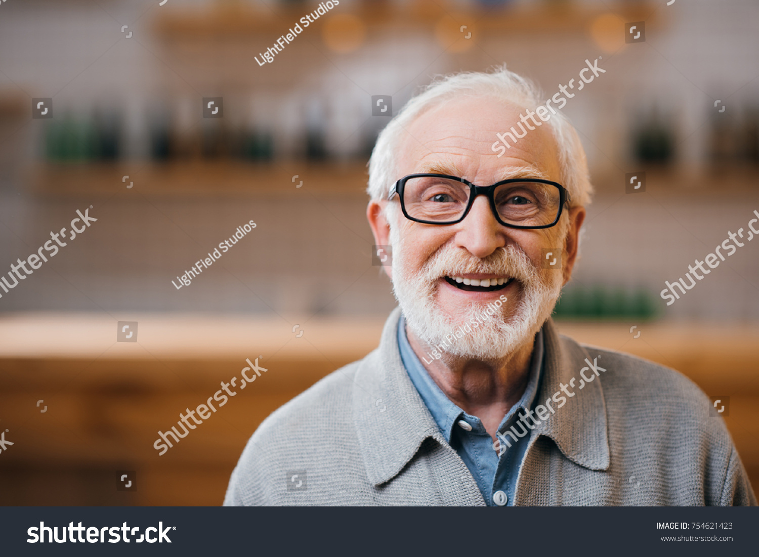 close-up portrait of happy senior man looking at camera #754621423