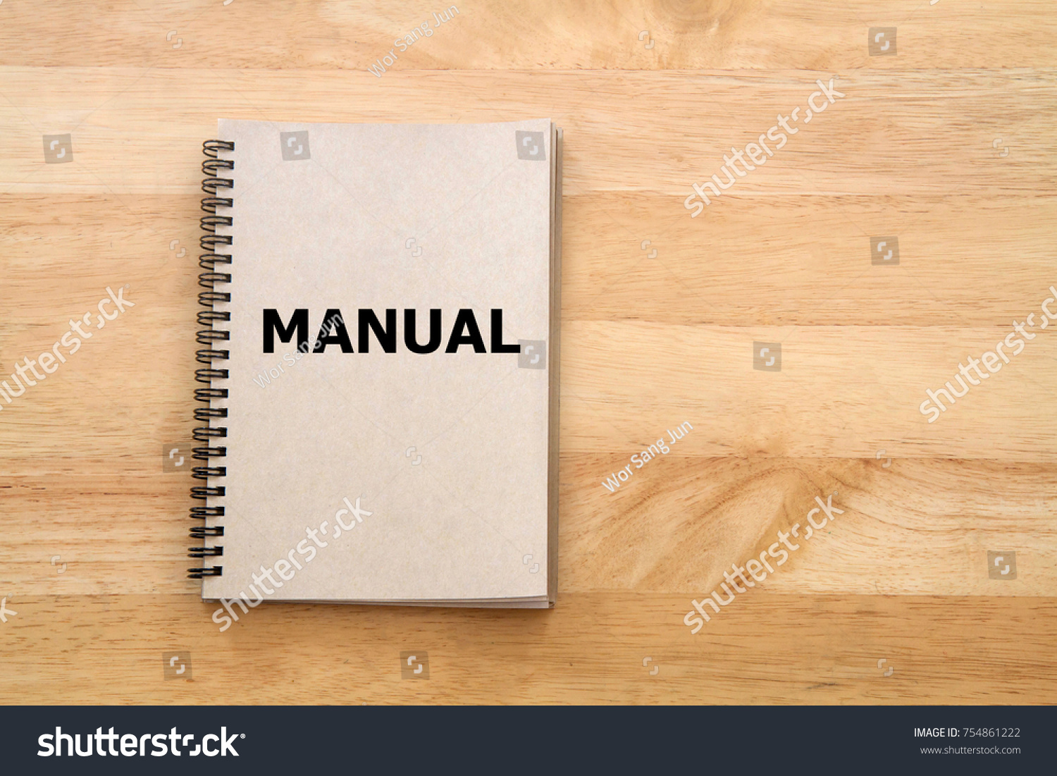 User manual or Instruction manual book on wooden desk #754861222