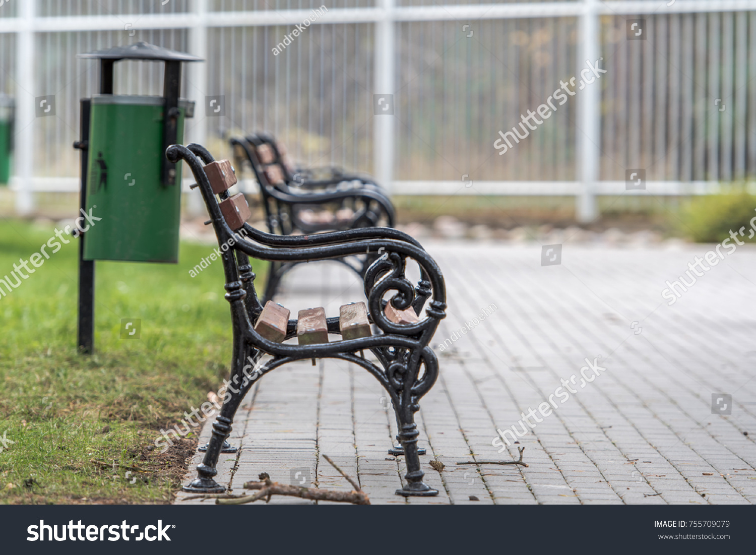 many park benches are on the edge of a rifle. Waste bins are ready for the residual waste #755709079