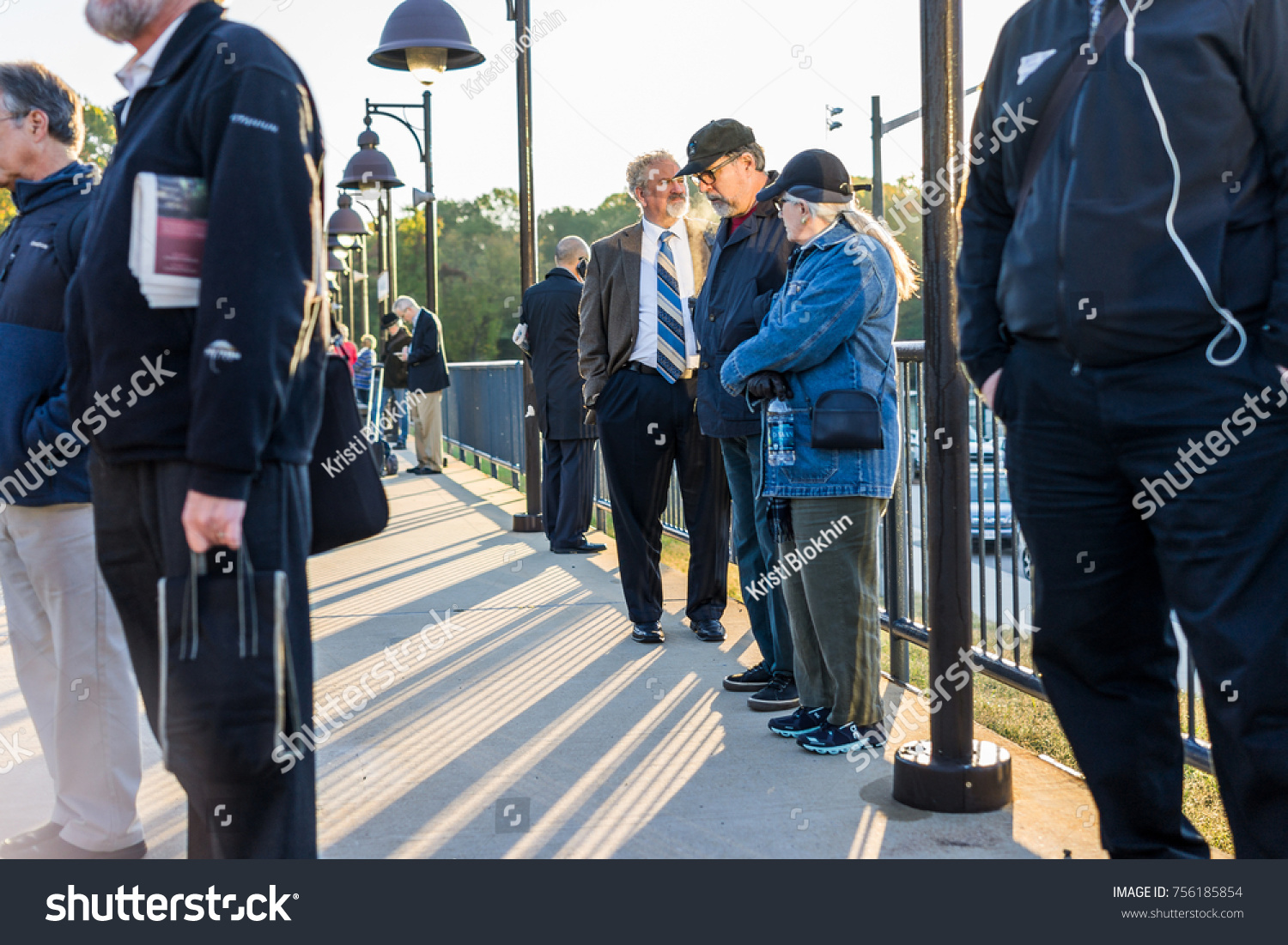 Burke, USA - October 27, 2017: Many people waiting on platform for VRE train to Washington DC for commute at Burke Centre Station during morning #756185854