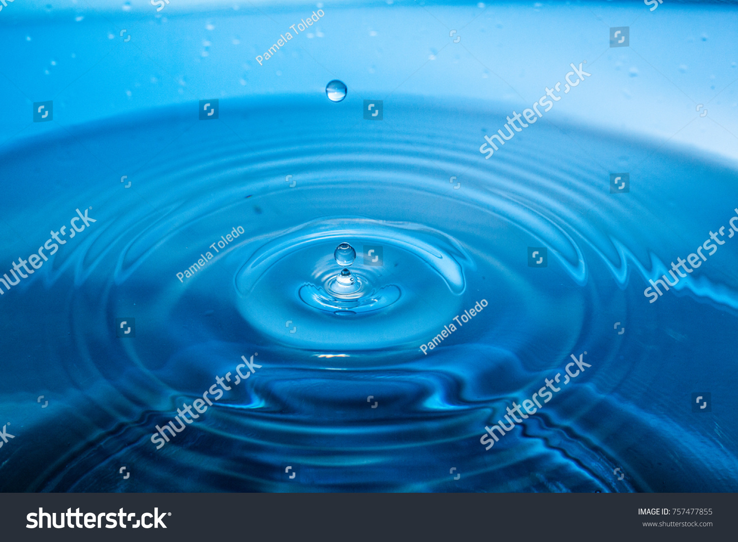 Water drop on water #757477855