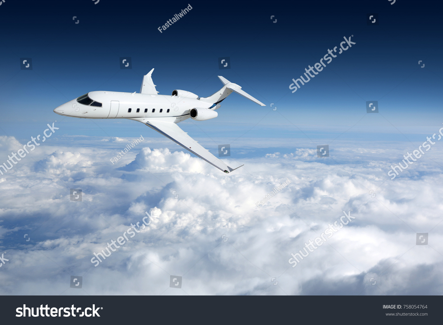 Business jet airplane flying on a high altitude above the clouds #758054764