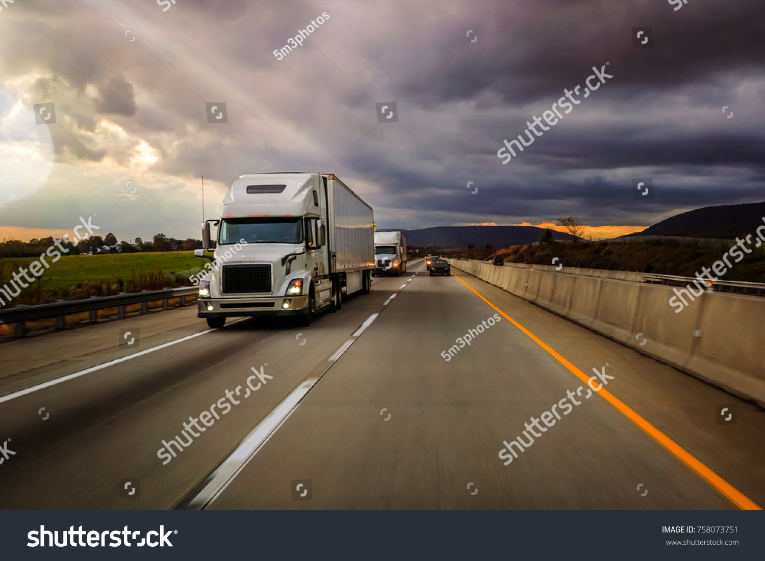 Two white 18 wheelers on highway platooning #758073751