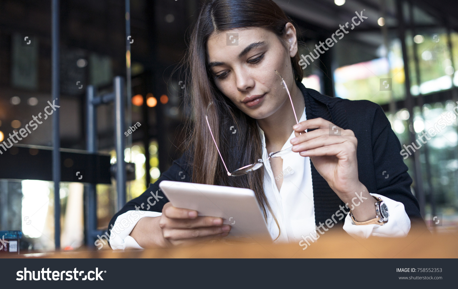 Young woman using digital tablet #758552353