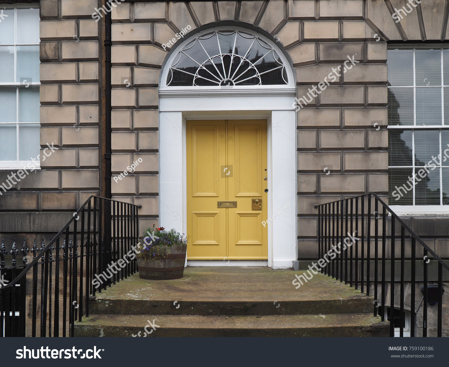 front door of old stone apartment building or office building #759100186