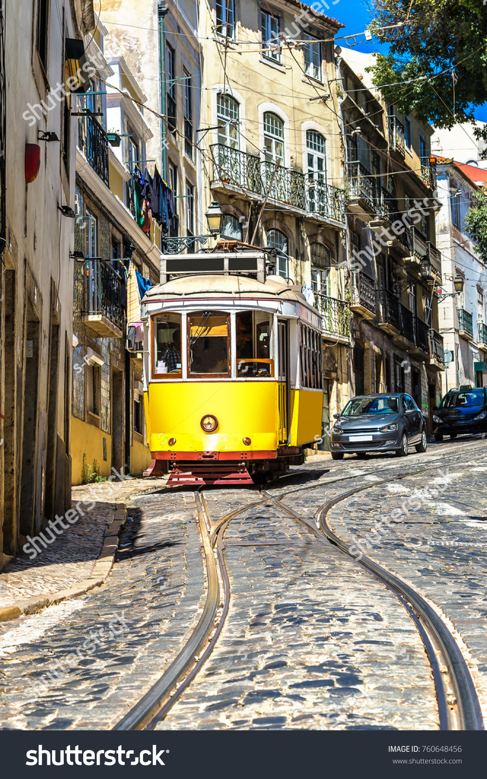 Vintage tram in the city center of Lisbon, Portugal in a summer day #760648456