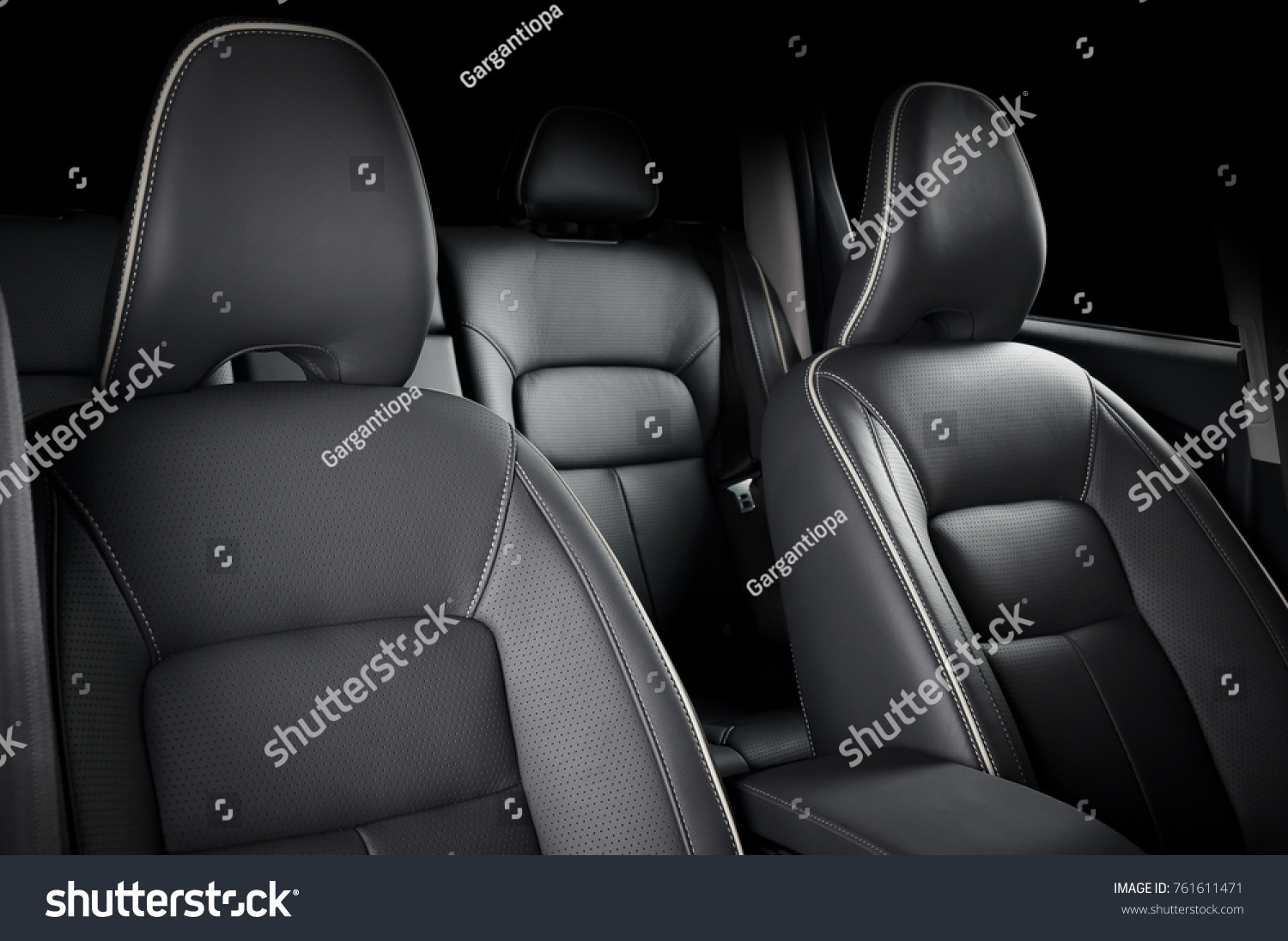 Luxury car inside. Interior of prestige modern car. Comfortable leather seats. Black perforated leather cockpit. #761611471