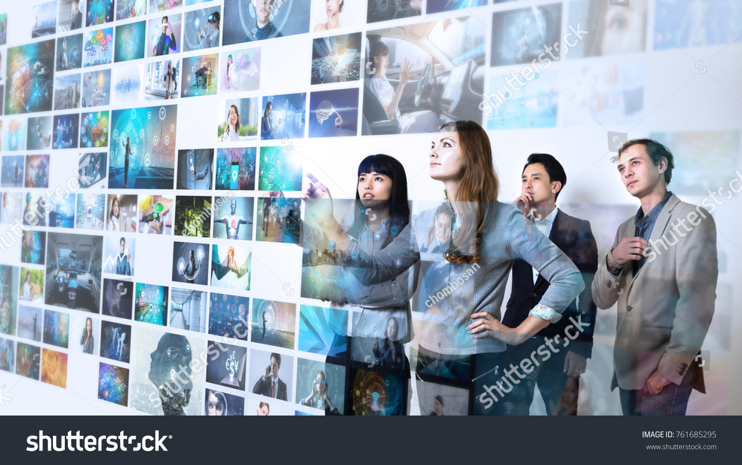 Group of people watching at a lot of pictures. Internet of Things. Information communication technology. #761685295