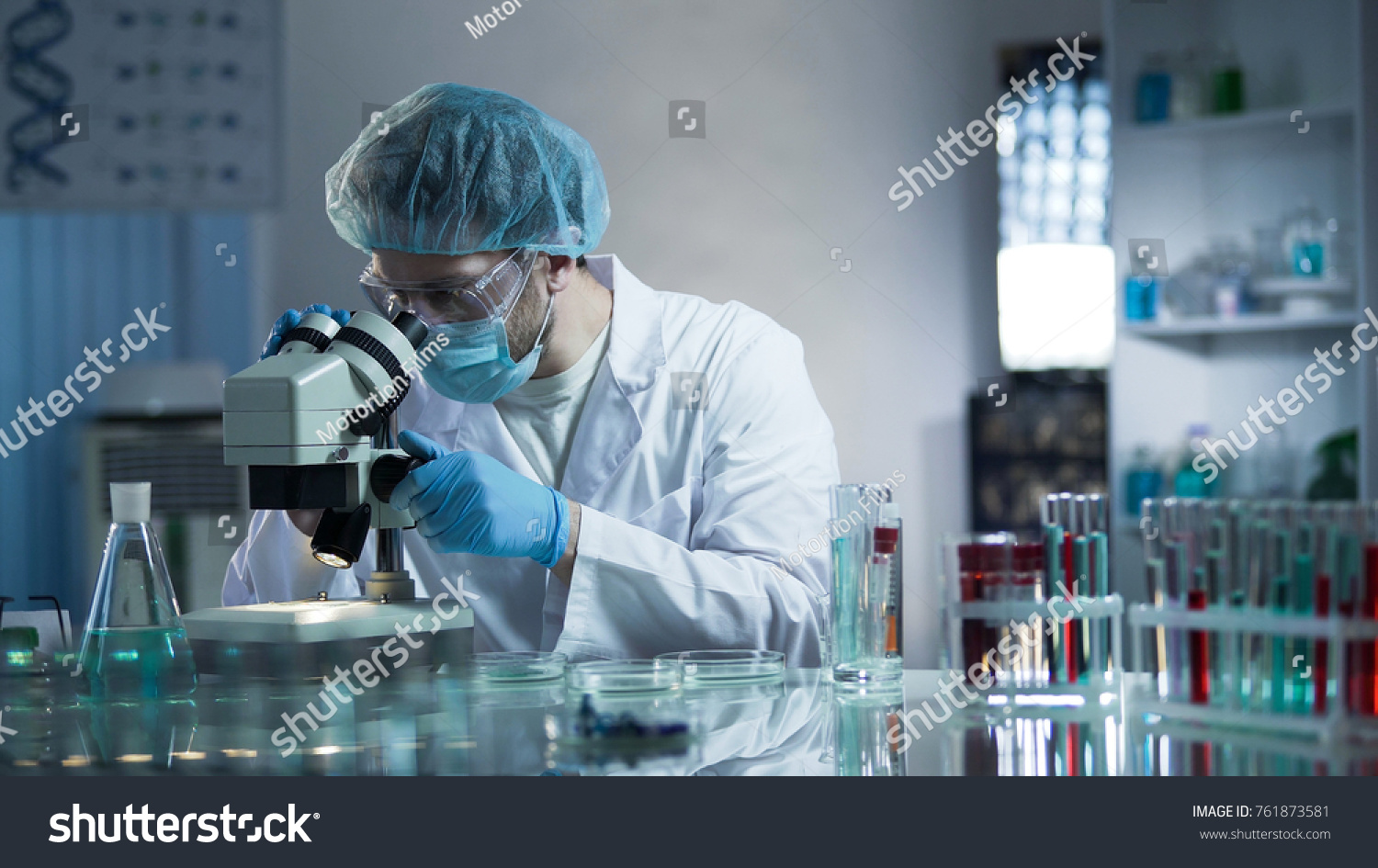 Laboratory worker carefully exploring samples to detect chronic pathologies #761873581