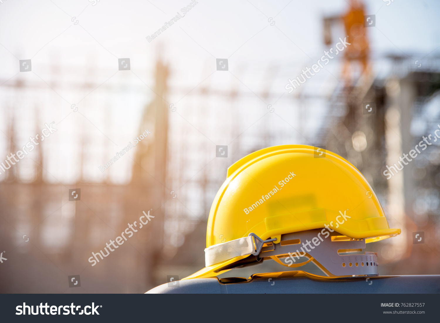 helmet in construction site and construction site worker background  safety first concept #762827557