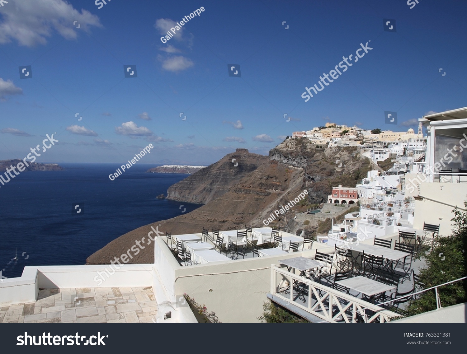 Panormaic view of the city of Fira with its cubiform buildings on Santorini Island, Greece. #763321381